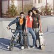 Three teens at skatepark