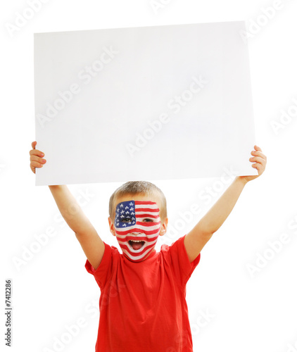 Photo: Young boy holding the blank white paper poster Young boy holding the blank white paper poster