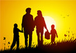 Happy family at sunset