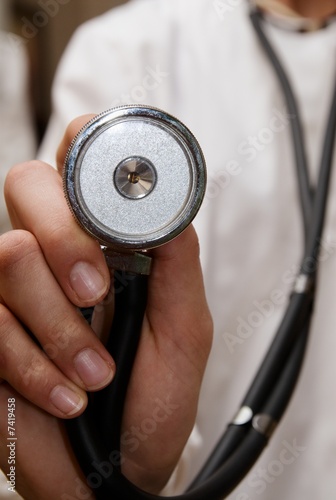 Photo: Stethoscope on a doctor on white lab coat Stethoscope on a doctor on white lab coat