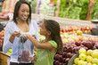 Mother and daughter in produce section