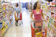 Two women shopping in supermarket