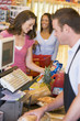 Woman paying for groceries