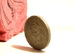 Photo: Crocodile and coin Crocodile and coin