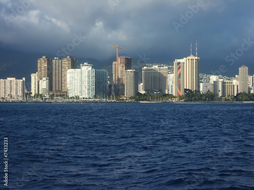 Photo: Bright Towers of Honolulu Skyline Viewed From Ocean, Hawaii Bright Towers of Honolulu Skyline Viewed From Ocean, Hawaii