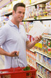 Young man grocery shopping