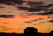 Arctic dawn: silhouette of a remote house Arctic dawn: silhouette of a remote house