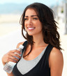 Smiling young woman with water bottle