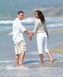 Young couple holding hands in the summer