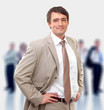 Businessman standing in front of a blurred background of people