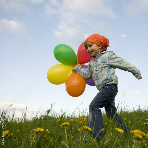 Photo: Little girl with baloons Little girl with baloons