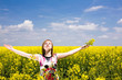 Happy girl on the rape field. Happy girl on the rape field.