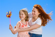 Mother and daughter with pinweel