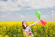 Happy girl on the rape field. Happy girl on the rape field.