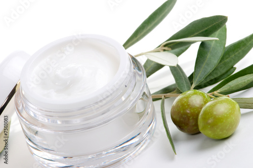 Face cream and olive twig
