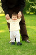 father and son on the grass