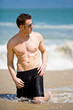 caucasian hunk at the beach with shades