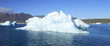 Panoramic view of an iceberg against a blue sky