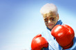 Photo: senior woman and boxing gloves senior woman and boxing gloves