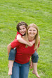 Mom Giving Daughter a Ride on Back