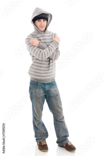 Photo: The young hip-hop man isolated on a white The young hip-hop man isolated on a white