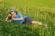 girl lying in field of dandelions