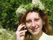 Girl in a chaplet talks by phone. Healthy rest. Girl in a chaplet talks by phone. Healthy rest.