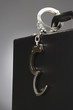 Handcuffs attached to briefcase in studio