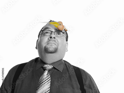 Photo: Businessman with Egg on his Face Businessman with Egg on his Face