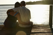 Couple Watching Sunset over Lake