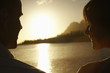 Couple Watching Sunset over Lake
