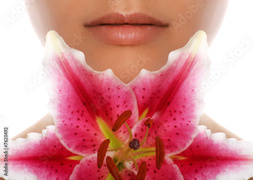 beauty portrait of a beautiful young woman with a lily flower