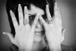 A woman takes her hand near face close-up