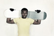 Teenager holding a snowboard