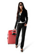 Beautiful woman walking with red travel luggage