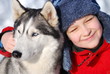 Happy boy with husky dog