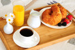 Breakfast on a bed in a hotel room Breakfast on a bed in a hotel room