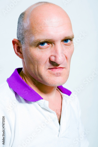 Photo: Portrait of the man indignation. Blue eyes. Bald Portrait of the man indignation. Blue eyes. Bald