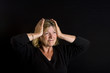Shot of a Senior Lady with Hands on her Head