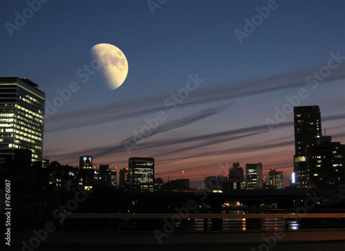 Photo: the moon on city. the moon on city.