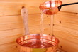 Pouring water in sauna