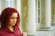 Beautiful young women between columns