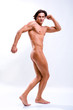 Sexy muscular man isolated on white. In all growth.