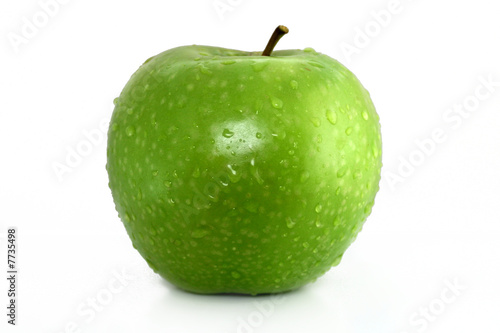 Photo: green apple with water drops on white background green apple with water drops on white background