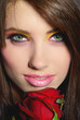 Portrait of woman with red rose