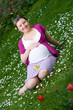 Pregnant woman on meadow