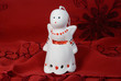 One angel made of ceramics on a red cloth
