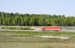 big red truck shot from far away - rural landscape