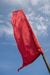 red flag on the blue sky background