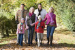 Photo: Multi-generation family on walk through woods Multi-generation family on walk through woods
